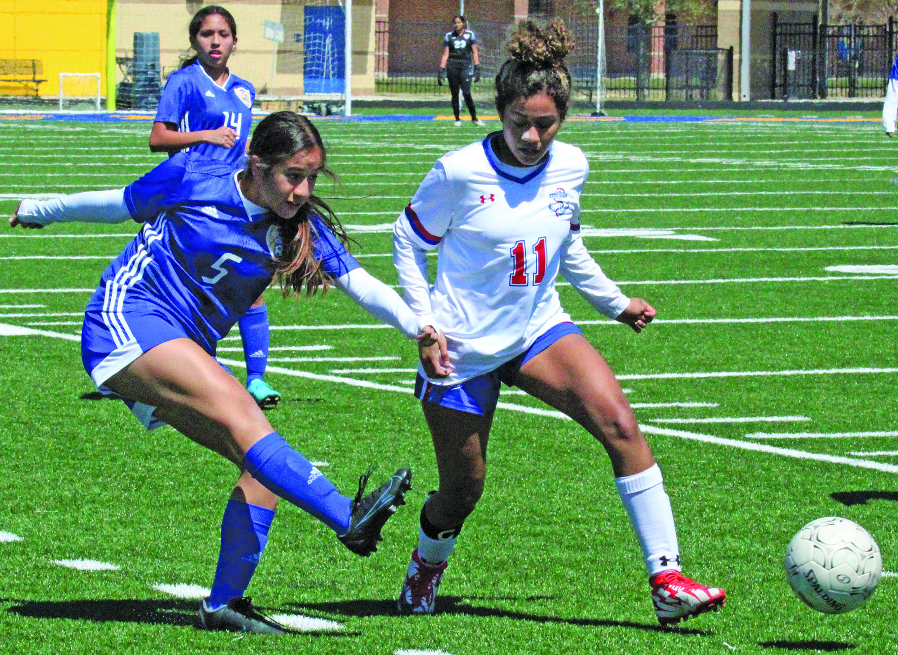 Photo by Anna Hernandez Bay City Ladycat sophomore midfielder Emily Reyes (5) directs the ball toward the Brazosport during Bay City’s 10-0 shutout of the Exporters at Memorial Stadium. Bay City now stands at 21-1-1 and 10-0 in district play.