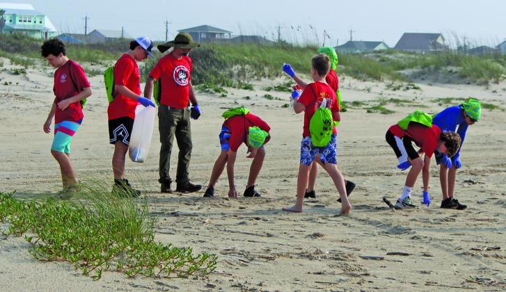Boy Scout Troop 828 from Sugar Land lent a hand picking up trash along Matagorda Beach during the annual Adopt-A-Beach Cleanup Saturday, April 20. The troop camped out on the beach the night prior and joined other local groups for the cleanup after their breakfast. Sentinel Photo/Jessica Shepard