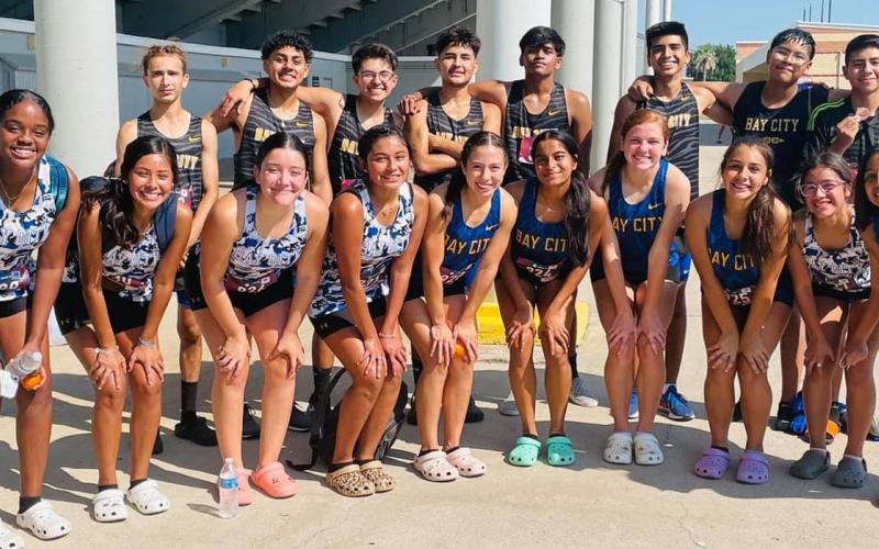 Contributed photo Both BCHS Cross Country boys and girls team pose for a photo at a recent meet in Texas City.