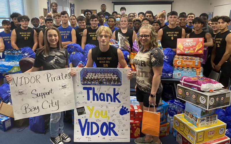 BCISD photo City of Vidor Mayor Misty Songe, at right, helped deliver a truckload of goods to the Blackcat football team Monday morning.