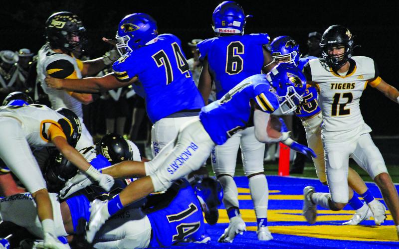 Sentinel photo/Mike Reddell Blackcat junior running back Ayden Smith (24) makes a successful lunge for a second-quarter touchdown. He scored both of Bay City’s touchdowns, the second from a fourth-quarter, 42-yard pass play from quarterback Joel Davalos.