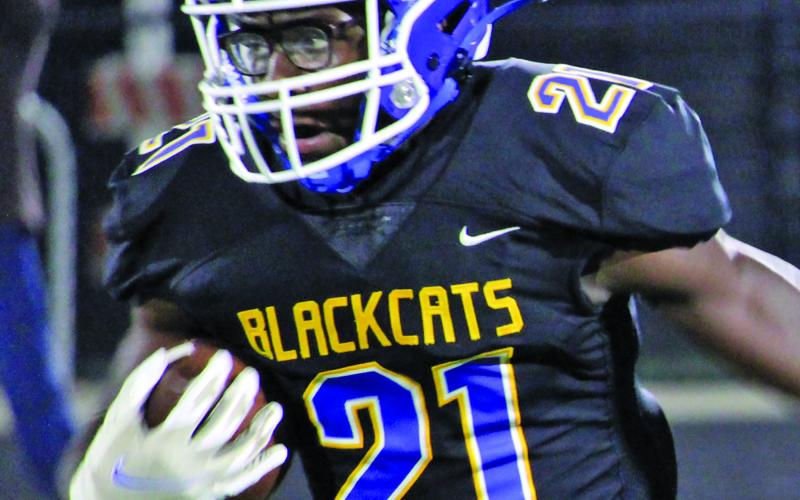 Sentinel photo/Mike Reddell Blackcat junior wide receiver Brice Turner (21) had team highs with 71 yards rushing with 59 return yards and two touchdowns.