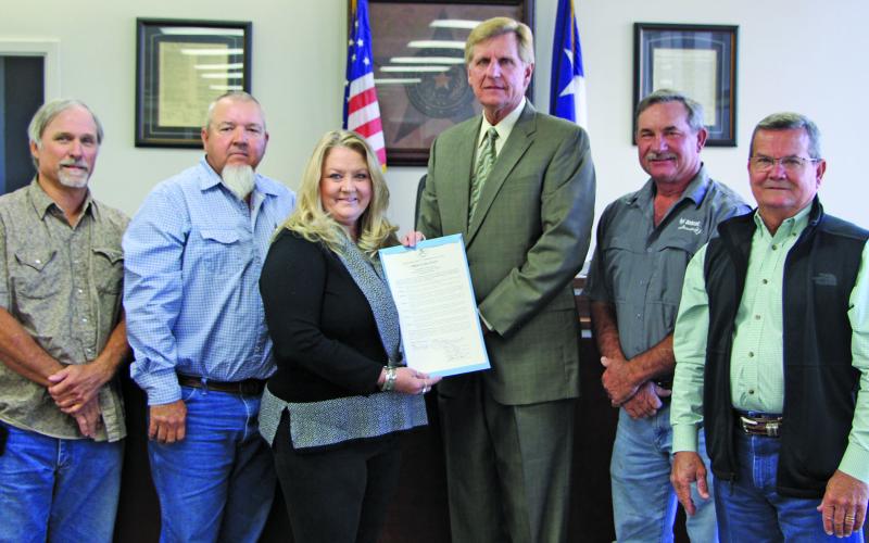 Matagorda County Commissioners Court recently proclaimed October as Domestic Violence Awareness Month. Shown, from left, are: Precinct 1 Commissioner Bubba Cook; Precinct 4 Commissioner Bubba Frick; Tammy McCullough, with The Crisis Center; County Judge Nate McDonald; Precinct 3 Commissioner Troy Shimek; and Precinct 2 Commissioner Kent Pollard. Sentinel photo/Mike Reddell