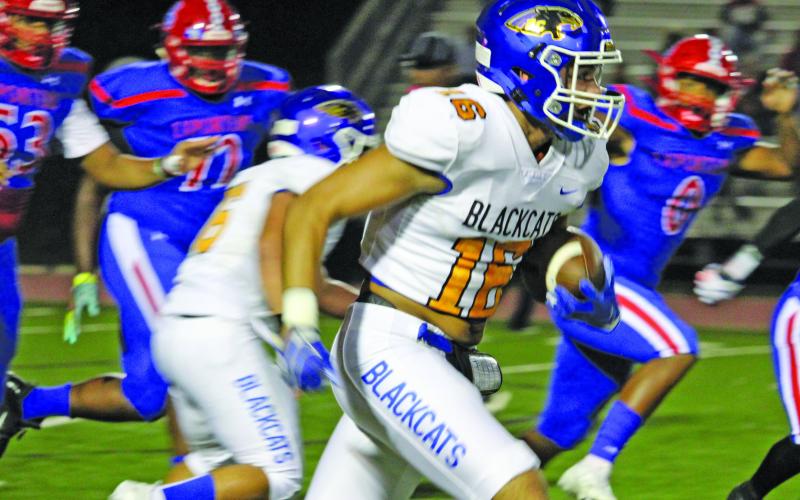 Sentinel photo/Mike Reddell Blackcat junior wide receiver David Perez (16) finds an opening on a pass from quarterback Joel Davalos against Brazosport Friday, Oct. 8. Perez had a team-high 93 yards in receptions and a touchdown.