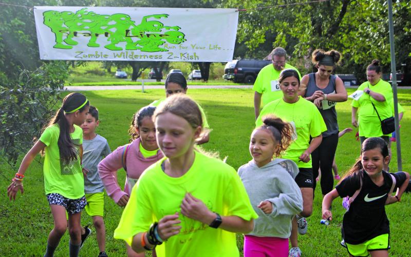 Sentinel photo/Mike Reddell Zombies of all ages begin this year’s Zombie Run at Riverside Park, Saturday, Oct. 23. The were prizes for different zombie and runner categories in the city sponsored event.