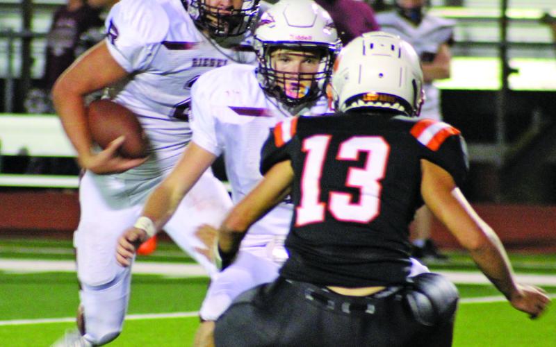 Sentinel photo/Mike Reddell Leopard Austin Hill (13) sets up for the Riesel quarterback (with the ball) and his lead blocker.