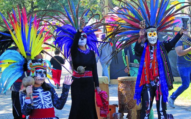 Sentinel photo/Jessica Shepard Bay City's "Day of the Dead" festival featured two costumed dance troupes as part of the live entertainment, Saturday, Nov. 6. This year's opening ceremonies were led by Calmecac Indigenous Organization, above. The organization is family-owned and dedicated to preserving and sharing traditional Indigenous Mexica philosophy, history, customs, culture, and arts to communities around Houston.
