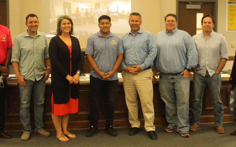 At right, Daniel Lara (center) is pictured at Nov. 16 board meeting with the BCISD trustees and Superintendent Dr. Marshall Scott III.