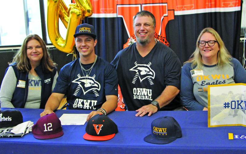 Sentinel photo/Mike Reddell Van Vleck High School baseball player Gunner Gibbens, second from left, signed with Oklahoma Wesleyan University in ceremonies Nov. 10, at the high school. Taking part in the ceremony were, from left: Gunner’s mother, Nell Gibbens; Gunner; his father, David Gibbens; and his sister, Karen Gibbens.