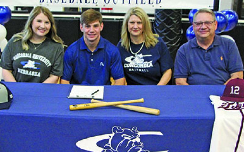 Sentinel photo/Mike Reddell Van Vleck High School baseball player Jace MacKenzie, second from left, signed with Concordia University in Nebraska in ceremonies Nov. 10, at the high school. Taking part in the ceremony were, from left: Jace’s sister, Taylor MacKenzie; Jace; his mother, Stacey MacKenzie; and his father, Joe MacKenzie.