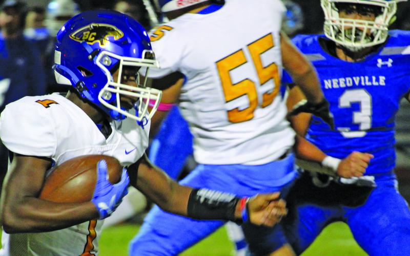 Sentinel photo/Mike Reddell Blackcat freshman running back Jada Andrews (1) tries to follow blockers against Needville last week.