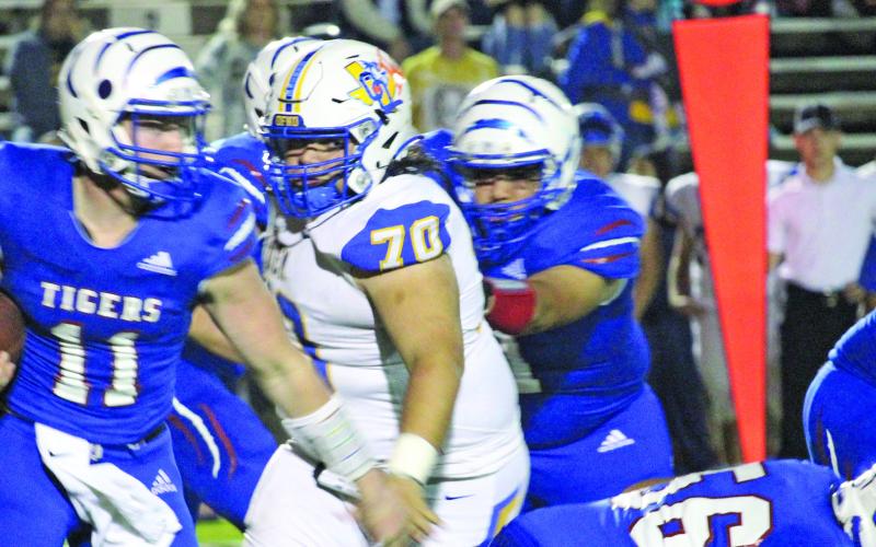 Sentinel photo/Mike Reddell Tidehaven quarterback Logan Crow (11) ran for 281 yards and four touchdowns in Saturday’s playoff against Odem..