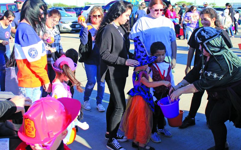 Sentinel photo/Jessica Shepard Dozens of families filled the parking lot for Schulman MBG's annual "Trunk or Treat" event Friday, Oct. 29. Children's costumes ranged from homemade to store-bought and featured pop culture characters along with the traditional fare of monsters, royalty and witches.