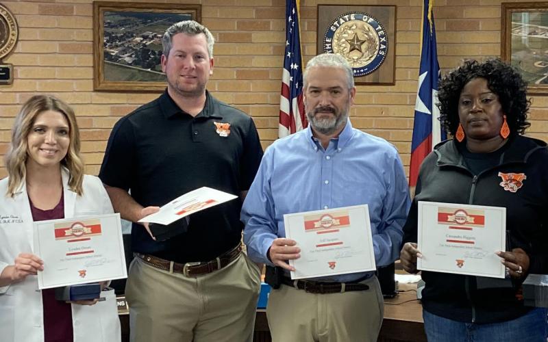 Sentinel photo/Jessica Shepard Van Vleck ISD recognized several staff members for their lifesaving efforts on a junior high student earlier this month. They were awarded the American Heart Association Heartsaver Hero and Top Leopard awards. Those employees are, from left: Gwen Franklin, Lyndee Owen, Michael Polachek, Jeff Jacques, Cassandra Higgins, Will Dowell, and not pictured: Darius Williams.