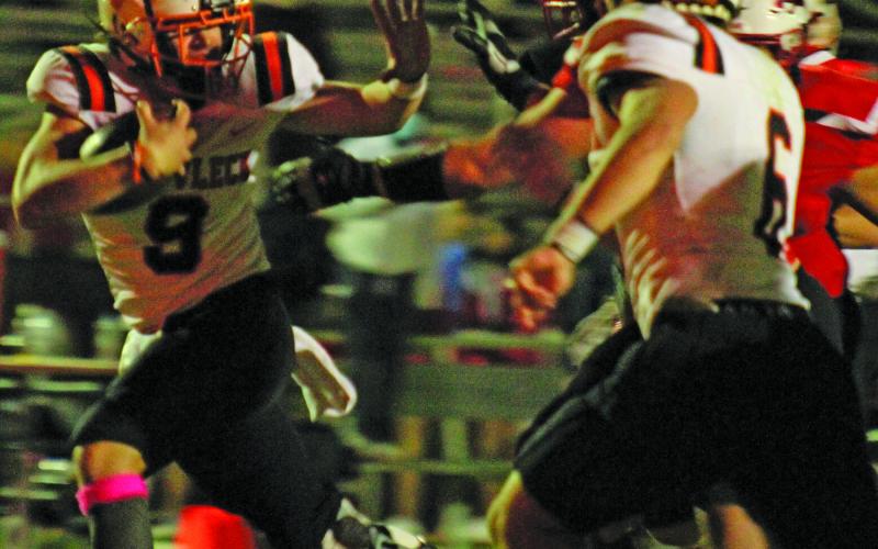 Sentinel photo/Jessica Shepard Van Vleck running back Sam Brooks (9) pushes back at Brazos defenders en route to a touchdown.