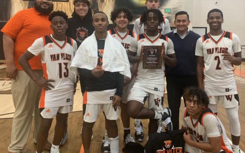 Contributed photo Leopard players and coaches show off tournament championship trophy..