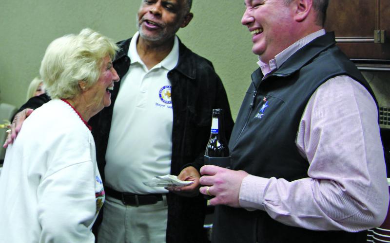 Sentinel photo/Jessica Shepard Above, from left, Alice Lowery, Mayor Robert Nelson, and MRMC CEO Warren Robicheaux share a laugh Nov. 18, when the MRMC Foundation partnered with Bay City Chamber of Commerce and Agriculture to host Business After Hours.