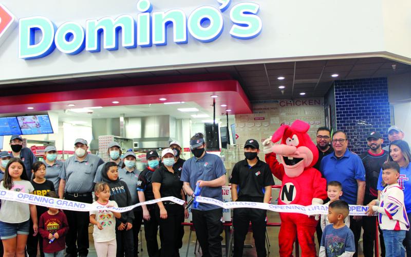 Sentinel photo/Jessica Shepard The Bay City Chamber of Commerce celebrated a ribbon-cutting ceremony with Domino's Pizza Saturday, Nov. 20. The pizzeria is located inside Walmart at 4600 Seventh Street in Bay City and delivers to Van Vleck residents.
