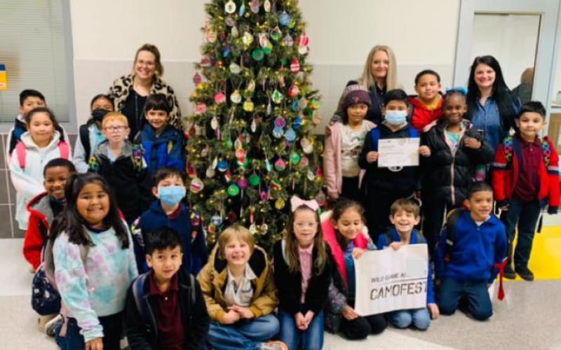 Mrs. Hutson’s STEAM class at Linnie Roberts won the Main Street Christmas Hay Bale Competition. Their creation is a school bus driven by Santa.  Butler Hay Farms and Homestead donated the hay. class  received a certificate, Baycityopoly game for their classroom, and a pizza party. Contributed photo