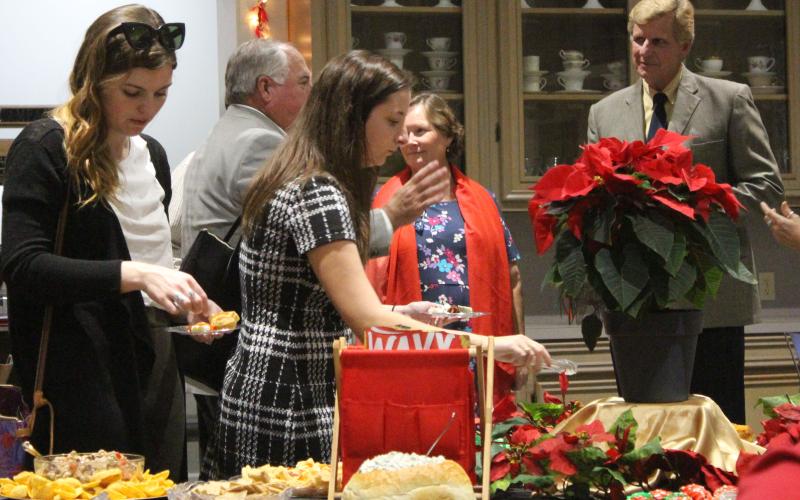 Sentinel photo/Jessica Shepard Guests gather recently at the Bay City Chamber of Commerce and Agriculture after-hours mixer at Matagorda County Museum.