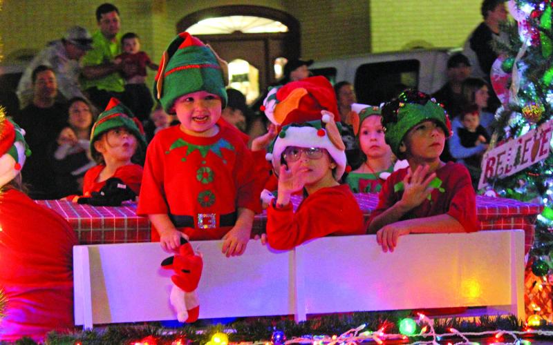 Sentinel photo/Mike Reddell This group of  Bay City Baptist Church elves show off their Christmas cheer during the annual "Lighted Christmas Parade" on Dec. 3. Bay City Baptist church won second place for its non-commercial float entry for the parade. There were nearly 50 total entries ranging from floats to bands and dance teams.