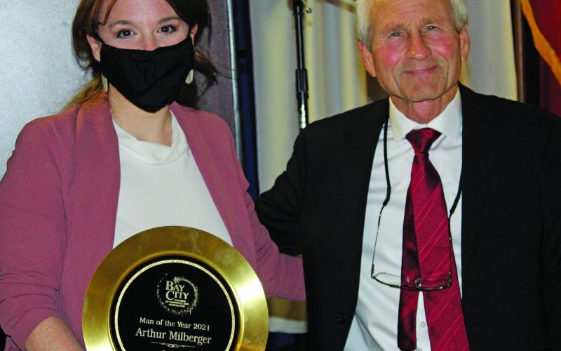 Sentinel photo/Jessica Shepard Arthur Milberger, above left, with Chamber Board Chairman Amanda Sitka received the Bay City Chamber of Commerce and Agriculture’s Man of the Year award at the chamber’s annual banquet Thursday, Jan. 20. Patsy Anderson, above right with Sitka, received the chamber’s Woman of the Year honor.
