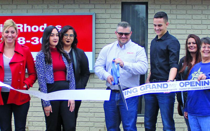 Sentinel photo/Jessica Shepard The Bay City Chamber of Commerce and Agriculture celebrated a grand opening and ribbon cutting for Justin Rhodes State Farm Friday, Jan. 7. The offices are located at 2409 Seventh St. in  Bay City.