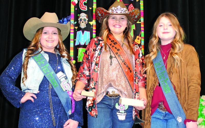 Sentinel photo/Jessica Shepard The MCFLA's 2022 Junior Fair Princess royalty court includes, from left: Taelynn Tinnin, Second Runnerup; Laynee Matchett, Junior Fair Princess, and Keagan Gerberman, First Runnerup.