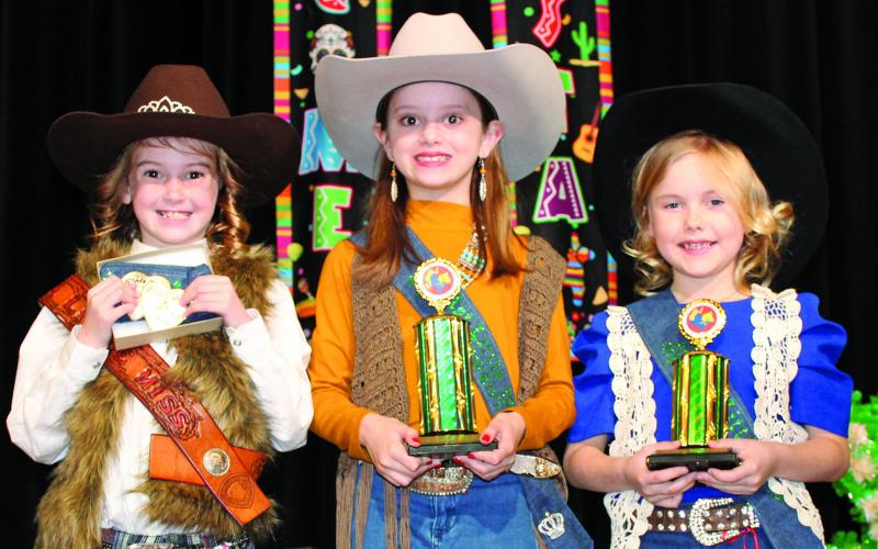Sentinel photo/Jessica Shepard The MCFLA's 2022 Little Miss Cowgirl royalty court includes, from left: Analyn Sutherland, Little Miss Cowgirl; Kathryn Rodgers, First Runnerup, and Lyra Saha, Second Runnerup.