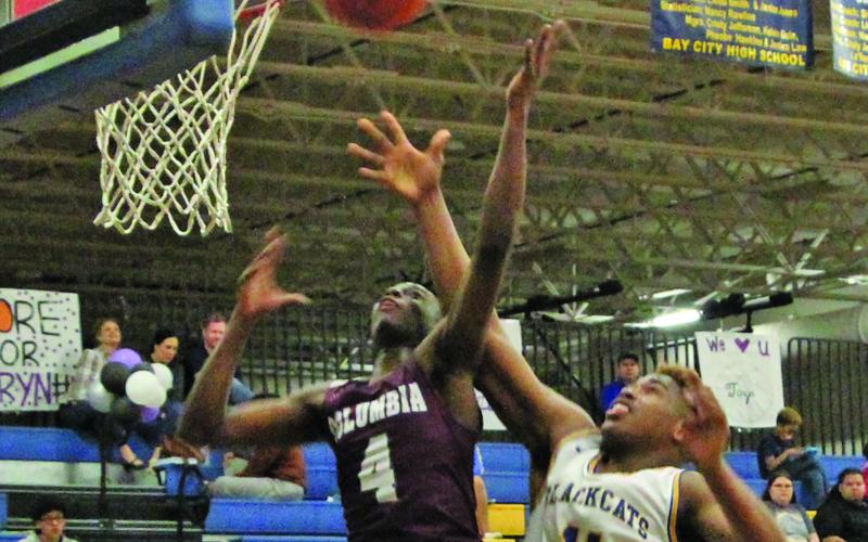 Sentinel photo/Mike Reddell Blackcat sophomore Carlon Jones (11) goes for a layup against a Columbia defender in Bay City’s 61-48 win over the Roughnecks here Feb. 1.