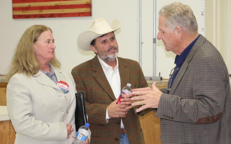 Sentinel photo/Mike Reddell Incumbent Precinct 4 JP Mark Finlay, right, visits with JP hopefuls Suzanne Sullivan (Precinct 2) and Jeff Elder (Precinct 6) following last week’s VFW politcal forum.