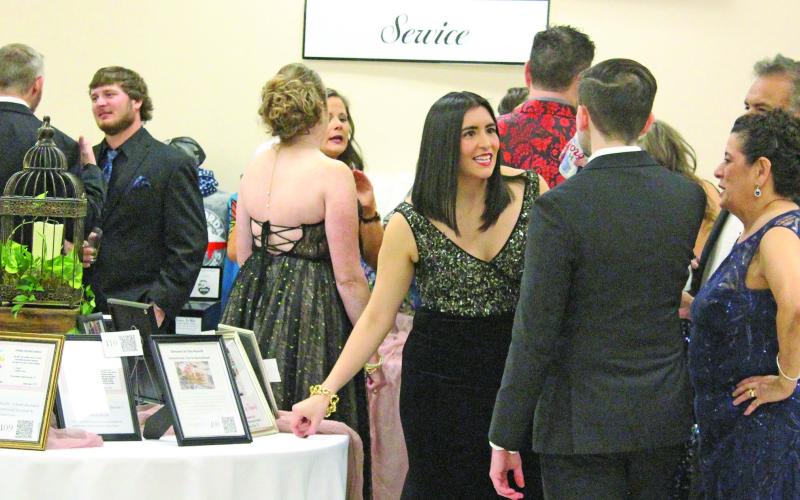 Those attending the 2022 Junior Service League (JSL) Charity Ball Saturday, Feb. 5, had plenty to talk about after missing last year’s event due to the pandemic.  Sentinel photo/Jessica Shepard