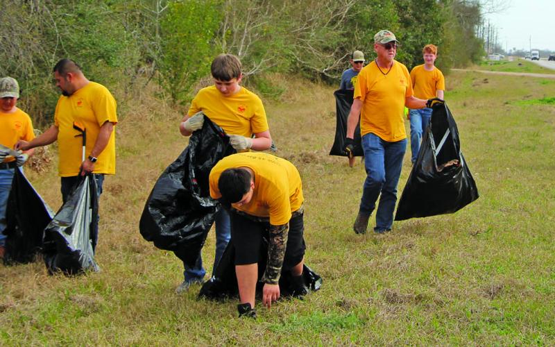 Sentinel photo/Mike Reddell Bay City Boy Scout Troop 45 joined by adult troop leaders picked up debris along FM 2668 near the Matagorda County Fairgrounds on Friday, March 4, during the 2022 fair.