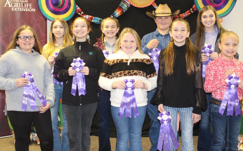 Sentinel photos/Jessica Shepard Matagorda County Fair and Livestock Association's Home Economics food entry winners received purple rosettes for their win as Grand Champions of their chosen divisions Saturday, Feb. 26. Winners include Marleigh Wendell, Camille Hutson, Taelynn Tinnin, Abigail Jurek, Jacob Oncken, Aribella Carson, Makayla Alford, Kali Claxton, Cheryl Saha, Jace Reynolds, Beatriz Valle, Shawn Sneath, Lacy Smith, Hunter Ryman, Emily Rodgers, and Ava Bowers.