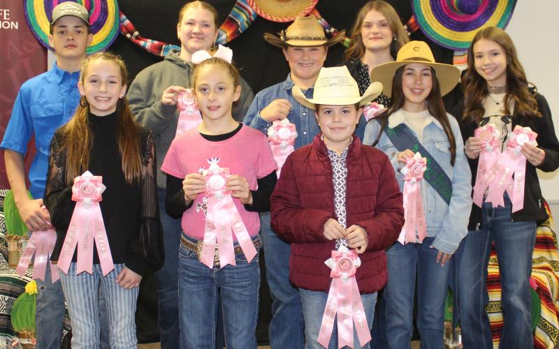 Sentinel photo/Jessica Shepard Matagorda County Fair and Livestock Association's home economics food division reserve grand champions earned pink rosettes for winning their chosen divisions Saturday, Feb. 26. Winners include Bryce Landry, Brynna Flores, Jace Girndt, Conner Scardami, Aribella Carson, Clara Dodd, Zane Lawhon, Jace Reynolds, Savannah Remmy, Karoline Murray, Shawn Sneath, Alex Lawhon, Audrey Delgado, and Madison Harris.