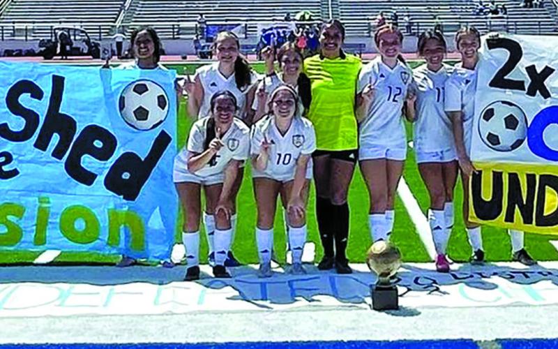 Courtesy photo The BCHS Ladycat Soccer team displays its banner proclaiming the girls undefeated district season following their 7-0 shutout of Needville Saturday, March 13, at Memorial Stadium. The girls were 14-0 in district and have compiled an overall season record of 23-1-1 and they’ll enter bi-district competition later this week.