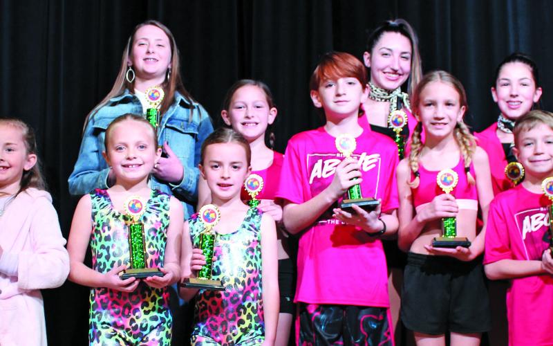 Sentinel photo/Jessica Shepard Winners of the annual Matagorda County Fair and Livestock Association Talent Show received their first-place trophies Sunday, Feb. 27. Winners from the front row are Meredith Jones, Leighton Savage, Cora Romine, Jacob Oncken, Ashley Alford, and Jase Alford; back row are Hannah Hjorth, Kynlee Tucker, Karsyn, and Karoline Murray.