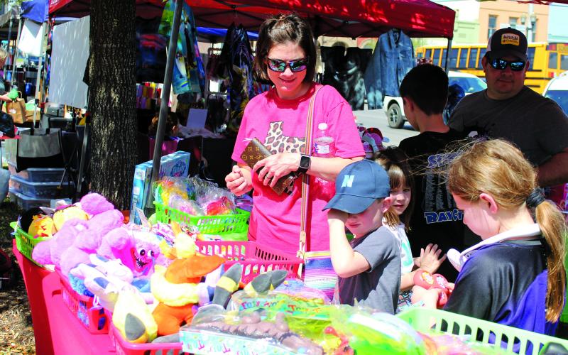Sentinel photo/Jessica Shepard The return of Matagorda County Trade Days featured a variety of vendors sporting Easter trinkets and wares, Saturday, March 26. One vendor had a variety of toys for Easter basket filler that these youngsters picked through.