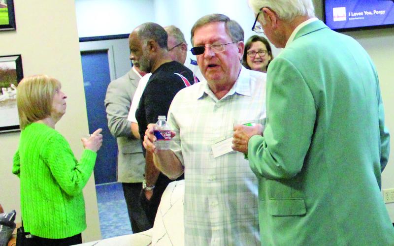 Sentinel photo/Jessica Shepard Several people helped Bay City Community Development Corporation celebrate St. Patrick’s Day for the March Bay City Chamber of Commerce and Agriculture mixer at BCCDC Thursday, March 17.
