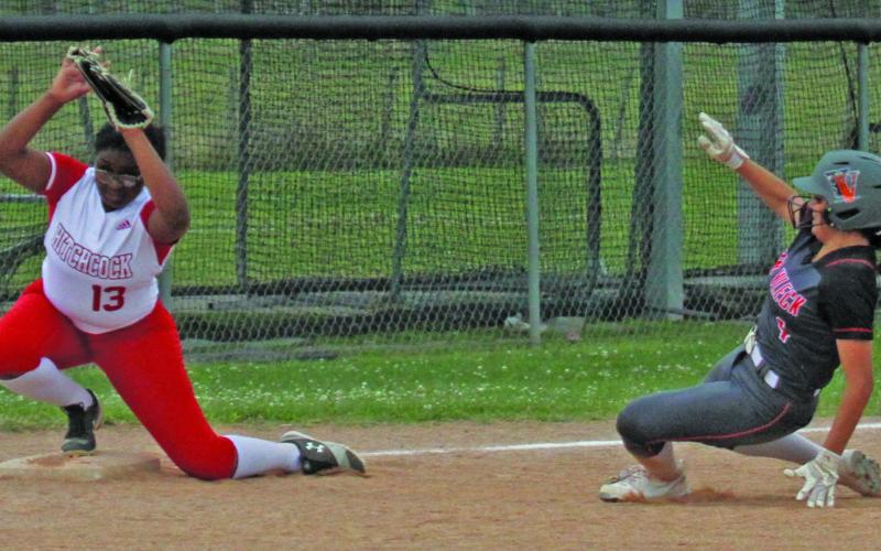 Photo/Anna Hernandez While the ball was still in play, Lady Lep Madison Rosado steals third and slides in to make it to the base against Hitchcock April 11.