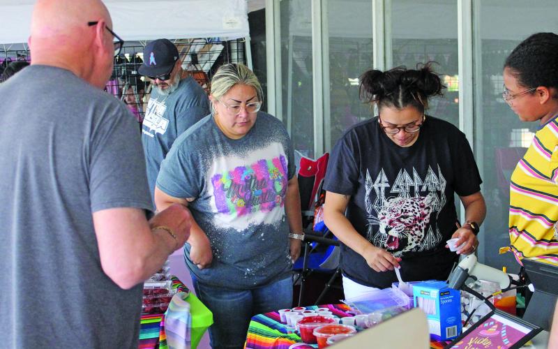 Visitors browsed a variety of wares along the courthouse square as part of the monthly "Matagorda County Trade Days" market day event, Saturday, April 23. Vendors were offering baked goods, live plants, knives and more.  Sentinel photo/ Jessica Shepard