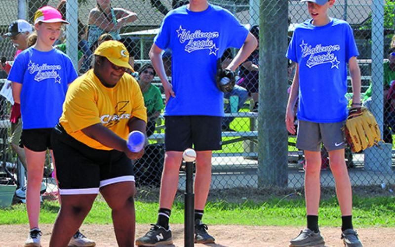Sentinel photo/Jessica Shepard Kennedie is cheered on by the staff of buddies