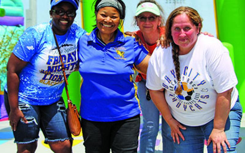 Sentinel photo/Mike Reddell Members of the Bay City All Sports Booster Club try out one of the three extra-large bouncy houses they set up at Memorial Stadium Friday, May 20, for the BCHS athletes following the sports awards ceremony, also at the stadium. The four include: Member Toni Plummer, President Janice Hopes; Fundraiser Karen Jones (back); and Vice President/Fundraiser Vicki Perez.