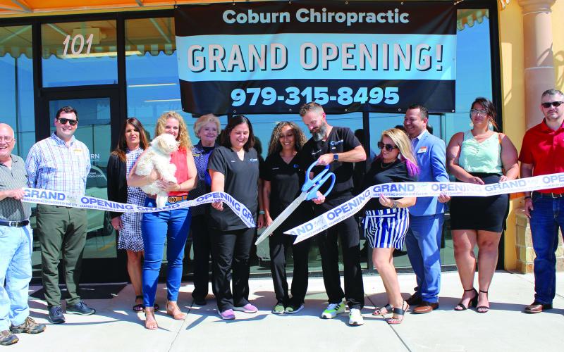 Sentinel photo/Jessica Shepard Coburn Chriopractic Center celebrated a grand opening ribbon cutting May 12 at its offices at 6500 Ave. F in Bay City.