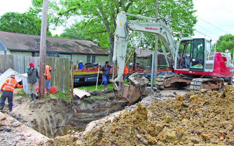 Sentinel Photo/Mike Reddell An excavator digs out space for a drain on Hamman Road last week as part of the city’s  Phase 1B Hamman Road drainage project.