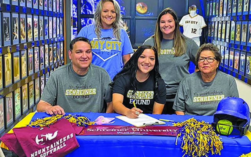 BCISD photo Ladycat softball standout Alyssa Gonzales signed with the Schreiner University Mountaineers in Kerrville on Wednesday, April 27. Alyssa is shown flanked by her parents, Tomas and Rachel Gonzales, and by her coaches behind her, Lindsey May (left) and Head Softball Coach Rilea Sanders. Alyssa lettered four years with the Ladycats and was offensive player of the year in 2020 and All-District Honorable Mention in 2021.