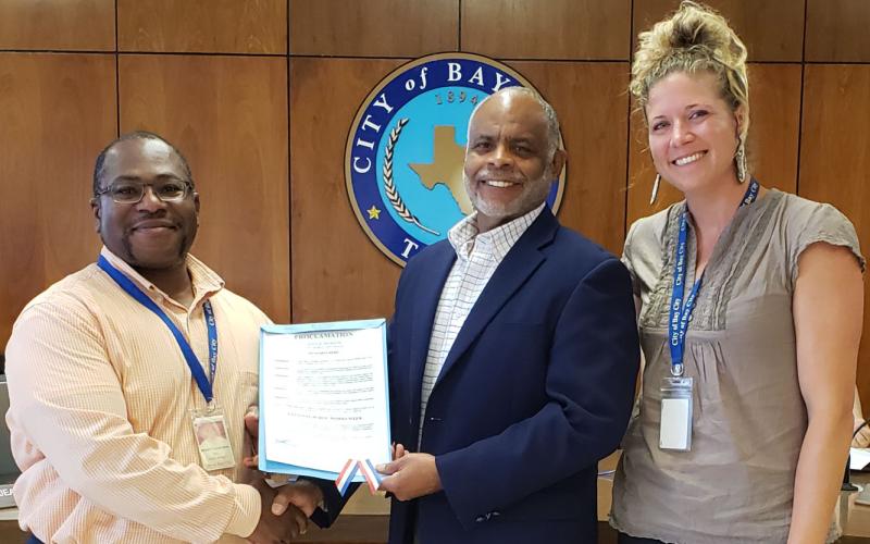 Sentinel photo/Jessica Shepard Bay City Mayor Robert Nelson, center, proclaimed May 15-21 as "National Public Works" week Tuesday, May 24. Nelson is flanked by Bay City Public Works Director Barry Calhoun and Engineering Tech Alyssa Dibbern. The proclamation states that the "city is safer, and individuals and families can enjoy the quality of life that makes Bay City special because of the dedication of public works professionals."