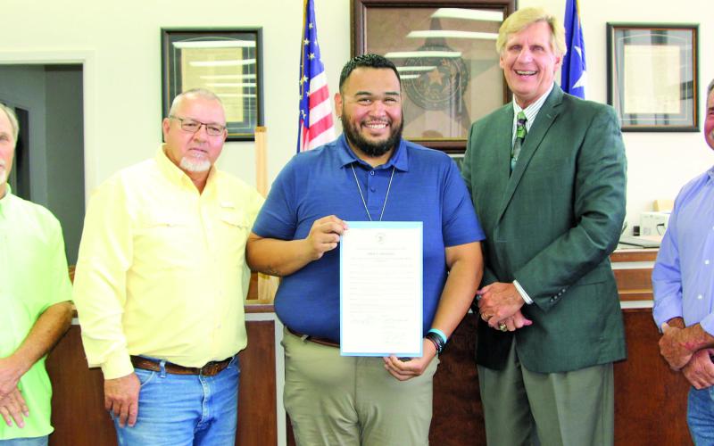 Sentinel photo/Mike Reddell Matagorda County Commissioners Court proclaimed June 2022 as Elder Abuse Awareness  Month at the court’s meeting Monday. Abuse of older adults and people with disabilities is a community concern, the proclamation reads. Shown, from left, are: Precinct 1 Commissioner Bubba Cook, Precinct 4 Commissioner Bubba Frick, Spokesman Daniel Bernal (with proclamation), County Judge Nate McDonald and Precinct 3 Commissioner Trey Shimek.