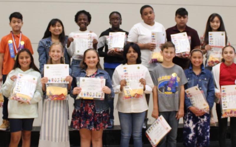 Sentinel photo/Jessica Shepard Bay City Lions Club members Mike Finster and Ed Weddell handed out Academic Achievement awards for Tenie Holmes Elementary students that had "All 'A' Honor Roll" for the entire school year, Thursday, May 26. Those students are: Dhani Burnett, Mason Cowart, Merrett Fortenberry, Bliss Garcia, Avery Hernandez, Amira Hoque, Suri Marquez Flores, Yoselin Martinez, Favour Onwuchekwa, Eva Schneider, Bailey Thomes, Taelynn Tinnin, Lillian Wurtz, and David Zamora.
