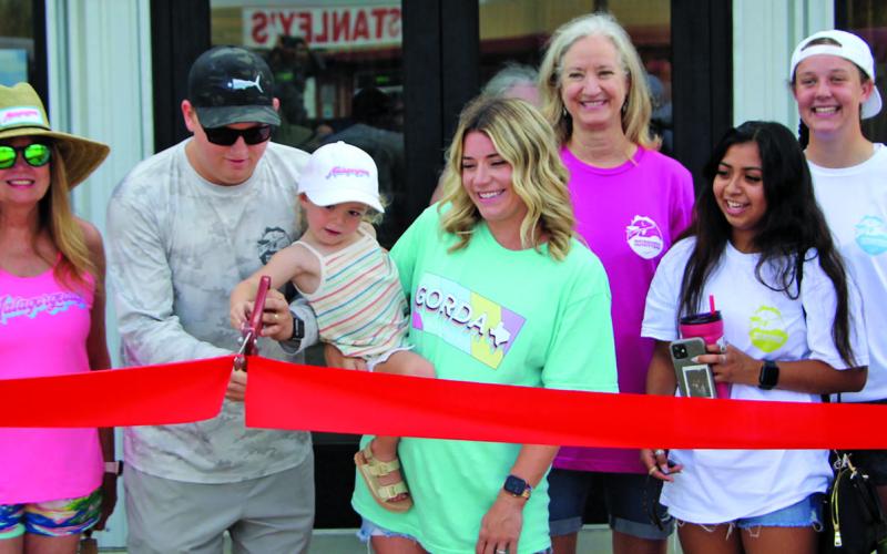 Sentinel photo/Mike Reddell Matagorda Outfitters celebrated its expansion with a grand opening and a ribbon cutting Saturday, May 28. Matagorda Outfitters features coastal and fishing apparel and outdoor wear - plus they are saltwater fly tackle outfitters